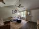 Inviting living room with vaulted ceilings, dark wood floors, stylish decor, and natural light at 7235 Hummingbird Ln, Winston, GA 30187
