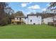Rear exterior view showing a refinished deck and level backyard at 9148 Homewood Dr, Riverdale, GA 30274