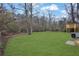 Newly sodded and level backyard featuring a refinished deck at 9148 Homewood Dr, Riverdale, GA 30274