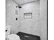 Bathroom features sleek black fixtures and modern tile throughout at 9148 Homewood Dr, Riverdale, GA 30274