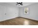 Inviting bedroom featuring wood-look floors and two closets for ample storage at 9148 Homewood Dr, Riverdale, GA 30274