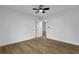 Clean bedroom with wood-look floors, and double doors to a closet or adjoining room at 9148 Homewood Dr, Riverdale, GA 30274