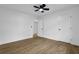 Comfortable bedroom with wood-look flooring, neutral walls, and convenient closet at 9148 Homewood Dr, Riverdale, GA 30274
