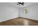 Well-lit bedroom showcasing wood-look flooring and ample natural light from a side window at 9148 Homewood Dr, Riverdale, GA 30274