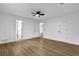 Spacious main bedroom features wood-look flooring and ensuite bathroom at 9148 Homewood Dr, Riverdale, GA 30274