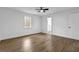 Bedroom includes modern ceiling fan, wood-look flooring and ensuite bath at 9148 Homewood Dr, Riverdale, GA 30274