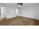 Bedroom features modern ceiling fan, wood-look flooring, and white walls at 9148 Homewood Dr, Riverdale, GA 30274