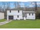 Charming two-story home with a freshly painted white exterior and well-manicured lawn at 9148 Homewood Dr, Riverdale, GA 30274