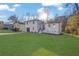 Landscaped front lawn and modern two-story home create a visually appealing curb appeal at 9148 Homewood Dr, Riverdale, GA 30274