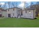 Lovely two-story house with a modern design, green lawn, and a welcoming front entrance at 9148 Homewood Dr, Riverdale, GA 30274