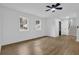 Spacious living area with hardwood floors, recessed lighting, and stairs leading to the upper level at 9148 Homewood Dr, Riverdale, GA 30274