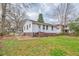Spacious backyard with a lawn, patio area, and partial fencing, perfect for outdoor activities at 933 Dell Se Ave, Smyrna, GA 30080