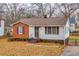 Charming single-story home with brick and siding, featuring a well-maintained front yard and inviting entrance at 933 Dell Se Ave, Smyrna, GA 30080