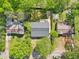 An aerial view of the property, showcasing its location amidst lush greenery and neighboring homes at 1596 Pontiac Se Pl, Atlanta, GA 30315