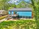 This backyard features a wood deck, stairs and an expansive grassy area at 1596 Pontiac Se Pl, Atlanta, GA 30315
