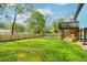 Expansive backyard with lush green grass and a wooden fence, perfect for outdoor activities and relaxation at 1596 Pontiac Se Pl, Atlanta, GA 30315