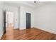 Spacious bedroom with wooden floors and a view into the next room at 1596 Pontiac Se Pl, Atlanta, GA 30315