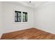 This bright bedroom has wood floors and a double window with natural light at 1596 Pontiac Se Pl, Atlanta, GA 30315