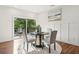 Bright dining area with sliding glass doors to a deck and a view of the backyard at 1596 Pontiac Se Pl, Atlanta, GA 30315