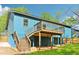 Back exterior of home, featuring a wooden deck with stairs leading to the yard at 1596 Pontiac Se Pl, Atlanta, GA 30315