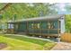 Beautiful blue home featuring a large porch and well-maintained yard, perfect for outdoor enjoyment at 1596 Pontiac Se Pl, Atlanta, GA 30315