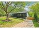 Charming home nestled among mature trees, featuring a spacious porch and a welcoming atmosphere at 1596 Pontiac Se Pl, Atlanta, GA 30315