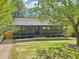 A beautiful home with a cozy front porch and well-kept lawn, showcasing its curb appeal and inviting ambiance at 1596 Pontiac Se Pl, Atlanta, GA 30315