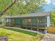 Inviting home with a charming front porch, perfect for enjoying the outdoors and adding to the home's appeal at 1596 Pontiac Se Pl, Atlanta, GA 30315