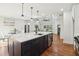 Spacious kitchen features a large island with pendant lighting and stainless steel appliances at 1596 Pontiac Se Pl, Atlanta, GA 30315