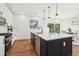 Stylish kitchen featuring a large island, white cabinets, and stainless steel appliances at 1596 Pontiac Se Pl, Atlanta, GA 30315