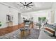 Open-concept living room with a view of the kitchen, dining area, and outdoor deck at 1596 Pontiac Se Pl, Atlanta, GA 30315