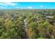 An aerial view showcases the lush greenery surrounding the property, offering privacy at 2233 Peachtree Ne Rd # 1207, Atlanta, GA 30309