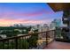 Large balcony offering stunning views of the city skyline at sunset at 2233 Peachtree Ne Rd # 1207, Atlanta, GA 30309