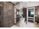 Inviting bath features a walk-in shower, soaking tub, and views into the bedroom at 2233 Peachtree Ne Rd # 1207, Atlanta, GA 30309