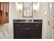 Contemporary bathroom featuring a marble vanity, dark wood cabinets, and elegant fixtures at 2233 Peachtree Ne Rd # 1207, Atlanta, GA 30309