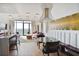 View of dining area with modern chandelier, seating, and access to the open-concept living space at 2233 Peachtree Ne Rd # 1207, Atlanta, GA 30309