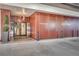 The Astoria Residences entrance features potted plants, and double doors with modern lighting at 2233 Peachtree Ne Rd # 1207, Atlanta, GA 30309