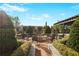 This outdoor gathering space features a built-in fire pit surrounded by seating and mature trees at 2233 Peachtree Ne Rd # 1207, Atlanta, GA 30309