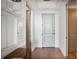 Bright hallway features hardwood floors, clean white walls, and an inviting front door at 2233 Peachtree Ne Rd # 1207, Atlanta, GA 30309