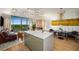 Bright, open living space featuring a modern kitchen with a large island and seating area at 2233 Peachtree Ne Rd # 1207, Atlanta, GA 30309