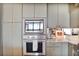 This modern kitchen features stainless appliances, green cabinets, and ample storage space at 2233 Peachtree Ne Rd # 1207, Atlanta, GA 30309