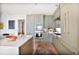 Kitchen featuring green cabinets, stainless appliances, white countertops, and an open layout at 2233 Peachtree Ne Rd # 1207, Atlanta, GA 30309