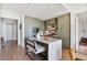 Bright kitchen featuring green cabinetry, a marble countertop island, and stainless steel appliances at 2233 Peachtree Ne Rd # 1207, Atlanta, GA 30309
