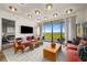 Bright living room with hardwood floors, contemporary furniture, and floor-to-ceiling windows with scenic views at 2233 Peachtree Ne Rd # 1207, Atlanta, GA 30309