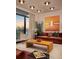 Cozy living room with stylish decor, modern artwork, and floor-to-ceiling windows showcasing a city view at 2233 Peachtree Ne Rd # 1207, Atlanta, GA 30309