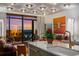 Bright living area featuring modern decor, kitchen island, and floor-to-ceiling windows with scenic sunset views at 2233 Peachtree Ne Rd # 1207, Atlanta, GA 30309