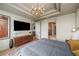 Well-lit main bedroom with a modern ceiling fan, large windows, and a full dresser at 2233 Peachtree Ne Rd # 1207, Atlanta, GA 30309