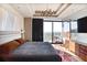 Main bedroom features city views, balcony access, and a gray quilt on the bed at 2233 Peachtree Ne Rd # 1207, Atlanta, GA 30309