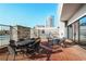 The patio is an open and airy area with a BBQ, table, and chairs for outdoor gathering at 2233 Peachtree Ne Rd # 1207, Atlanta, GA 30309