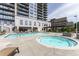 Relaxing rooftop pool and jacuzzi area with comfortable lounge chairs for residents at 2233 Peachtree Ne Rd # 1207, Atlanta, GA 30309